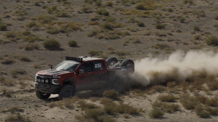 Team Chevrolet driver Chris Woo pilots the Next-Generation Silverado through the Nevada desert. alt text